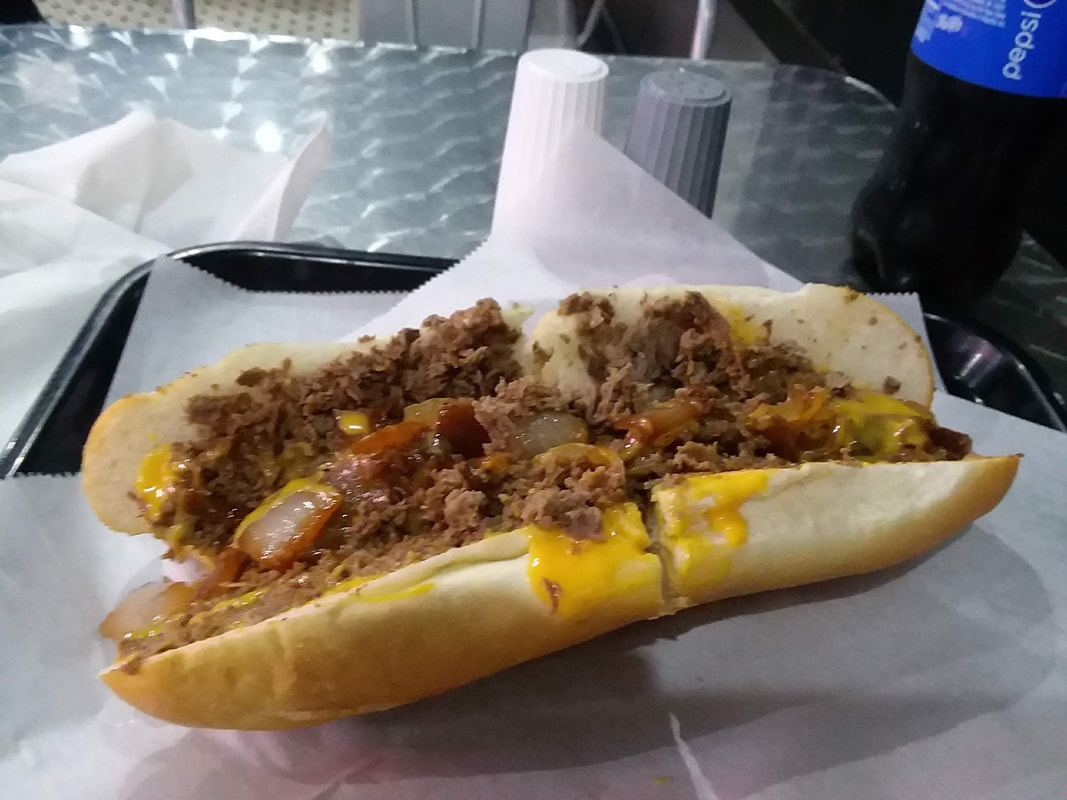 Philly steak with yellow cheese