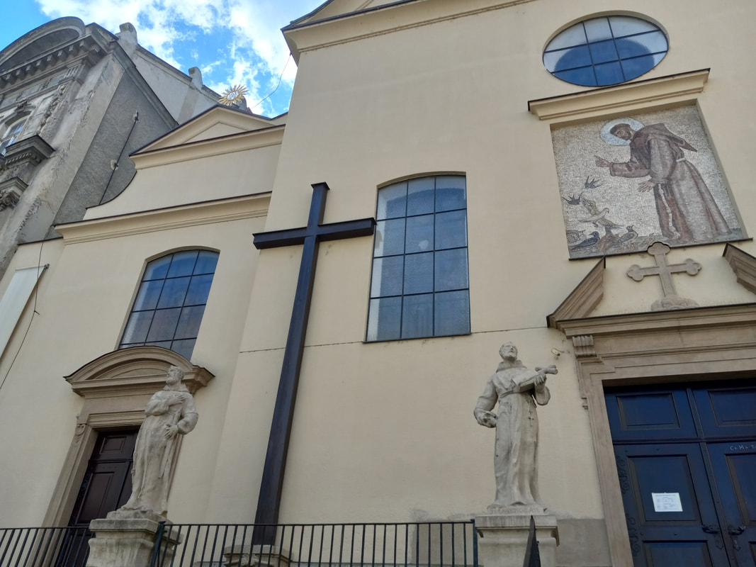 Facade with cross and statues