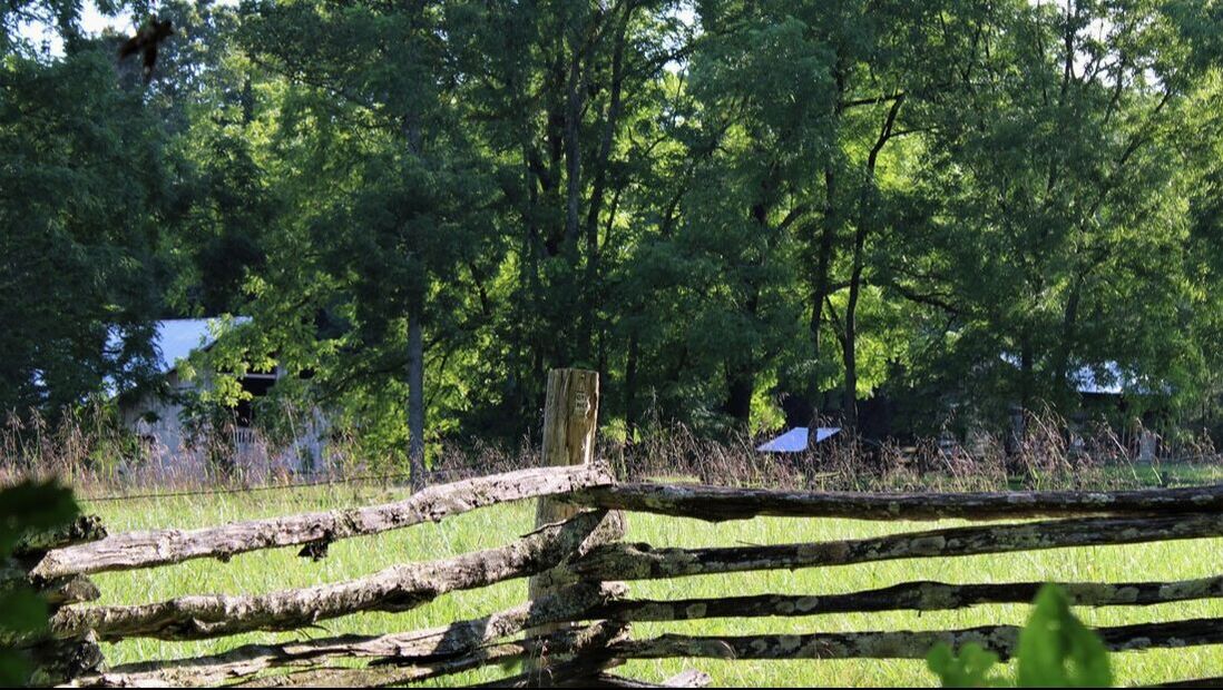 old wood fence surrounding farm