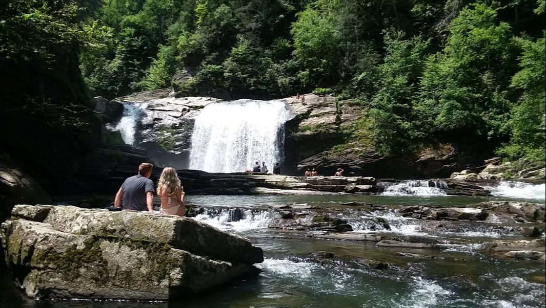 couple relaxing at the waterfall