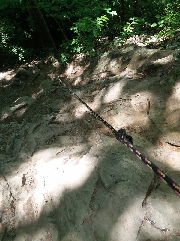 A rope leading down the steep trail