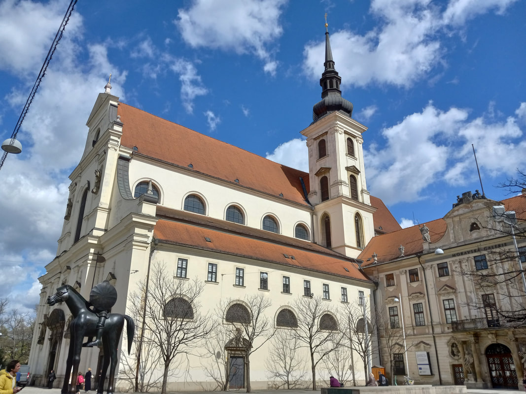 church exterior with mounted horse statue